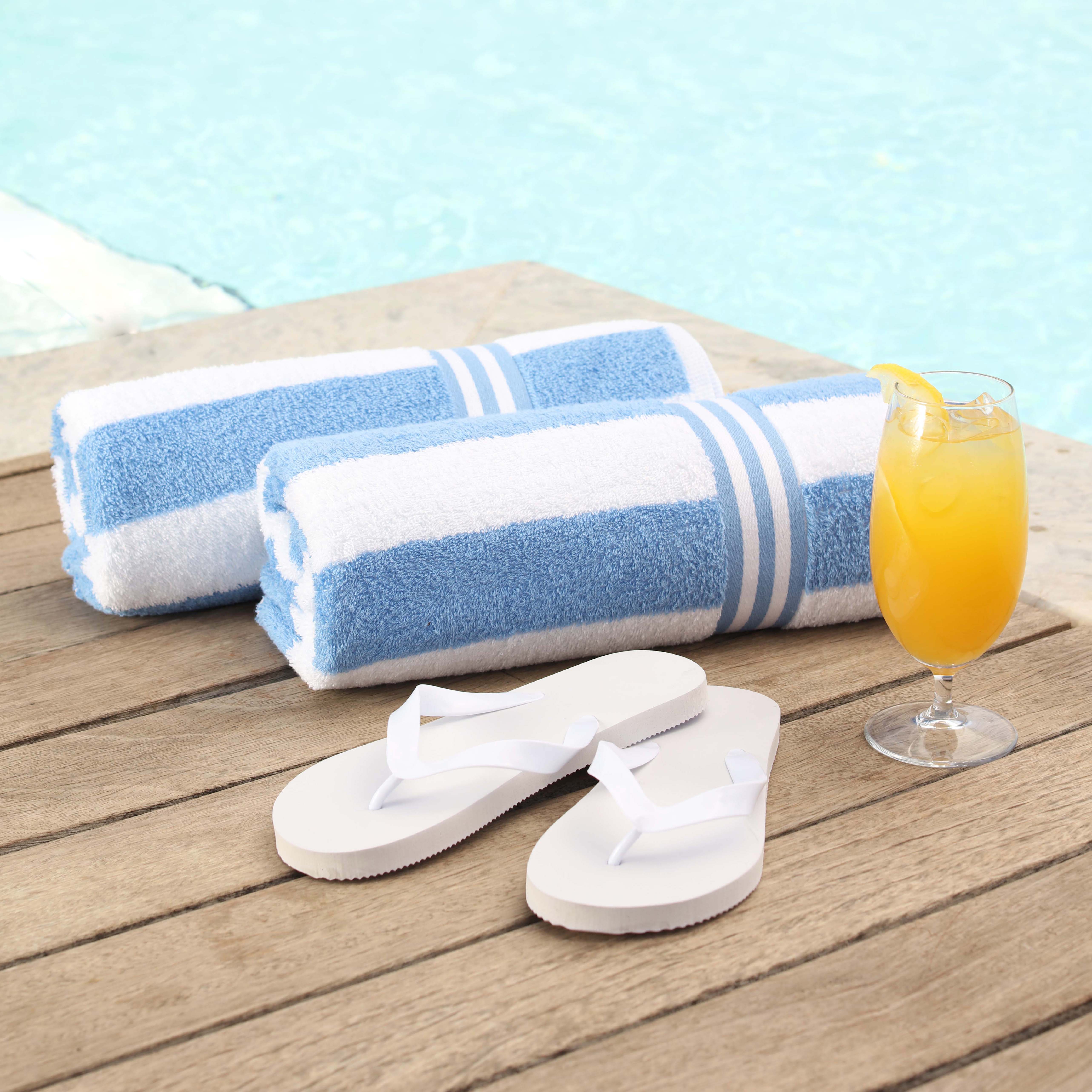 White flip flop towels and orange juice
